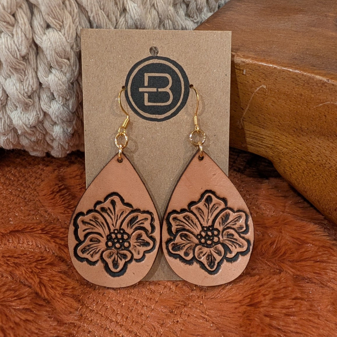 natural floral earrings on branded display card