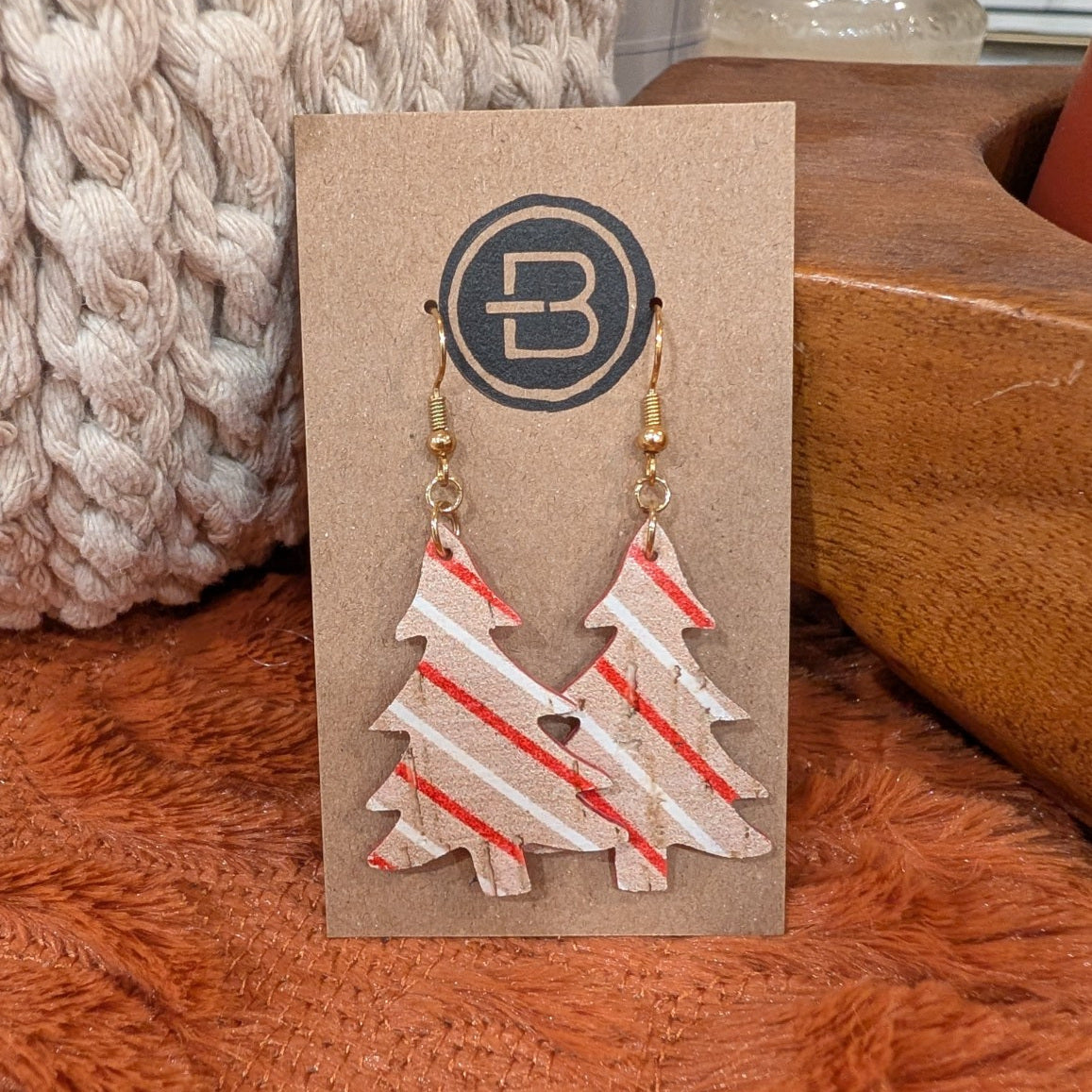 striped christmas tree earrings on branded display card
