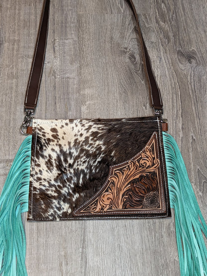Hair on crossbody purse with tooling and turquoise fringe