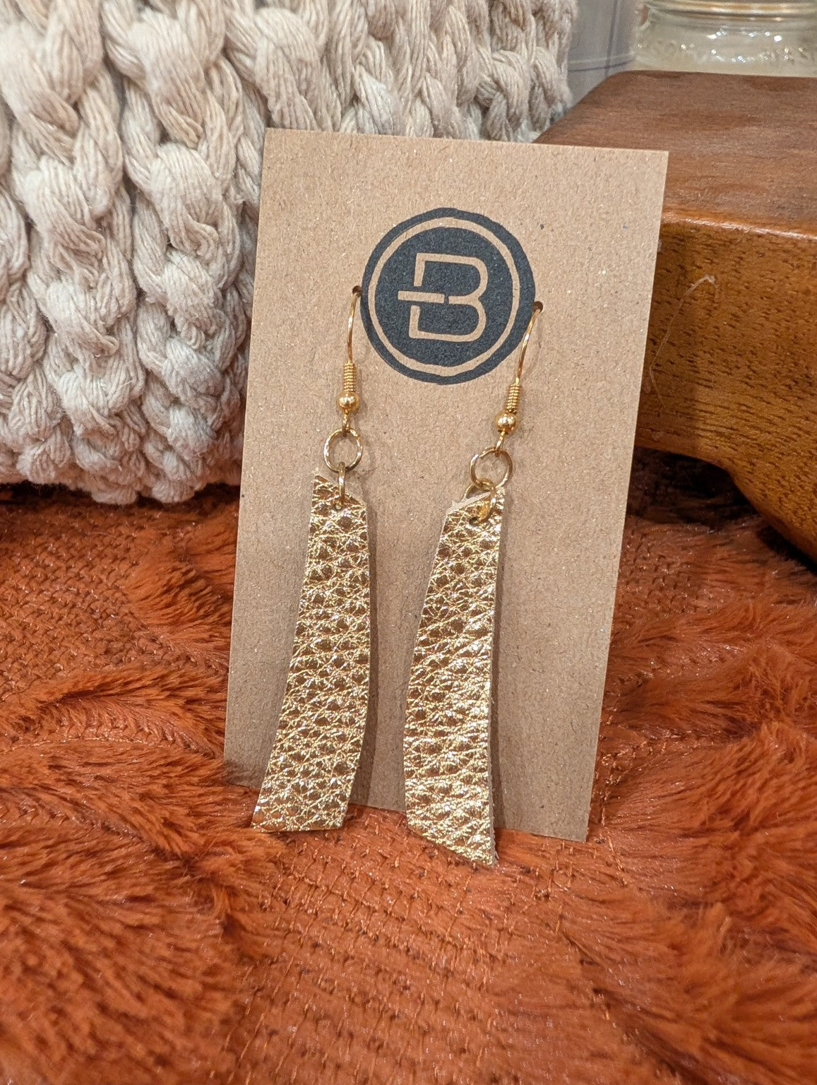 Textured metallic gold long bar leather earrings